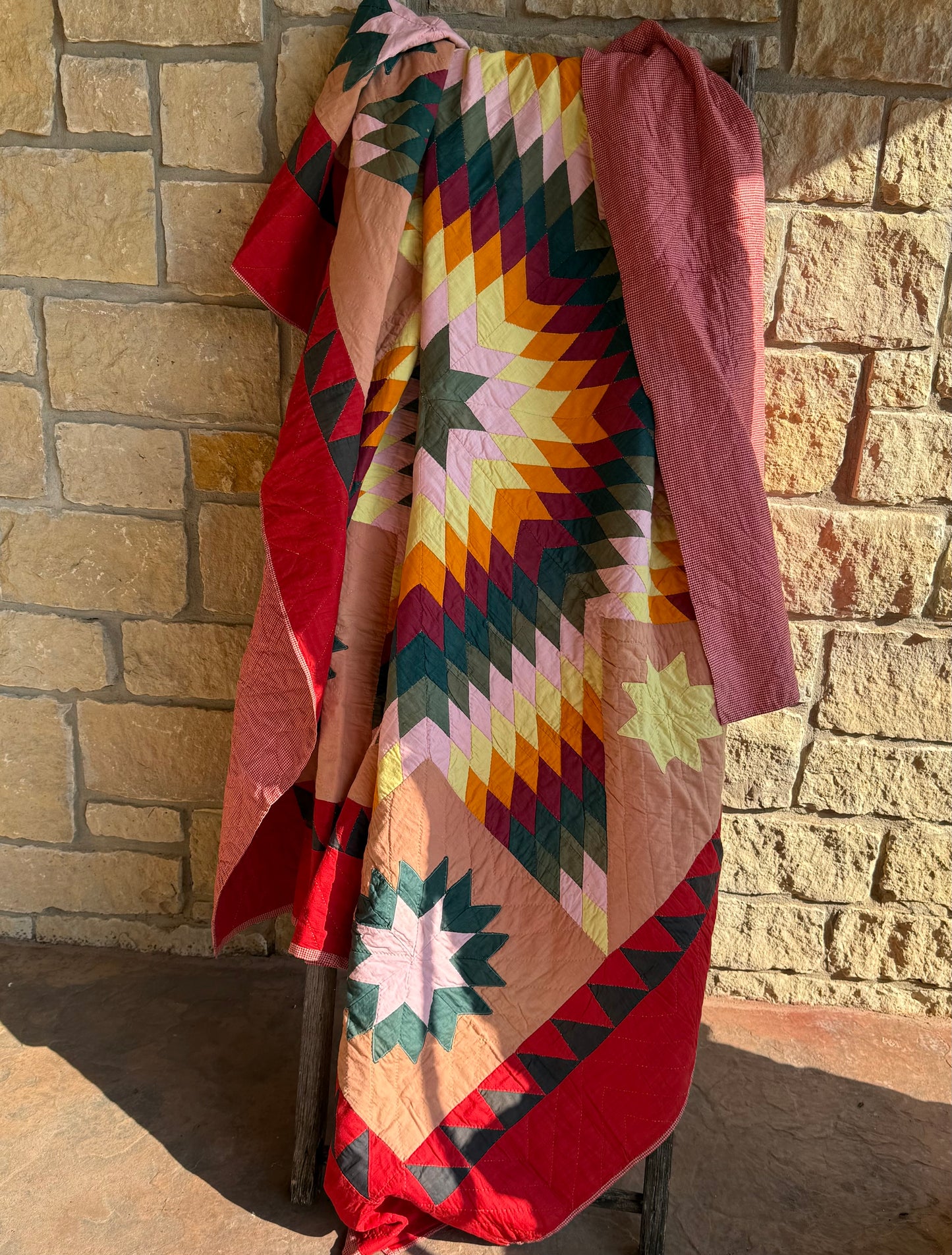 Blazing Star with Satellite Stars Quilt with a Sawtooth Border