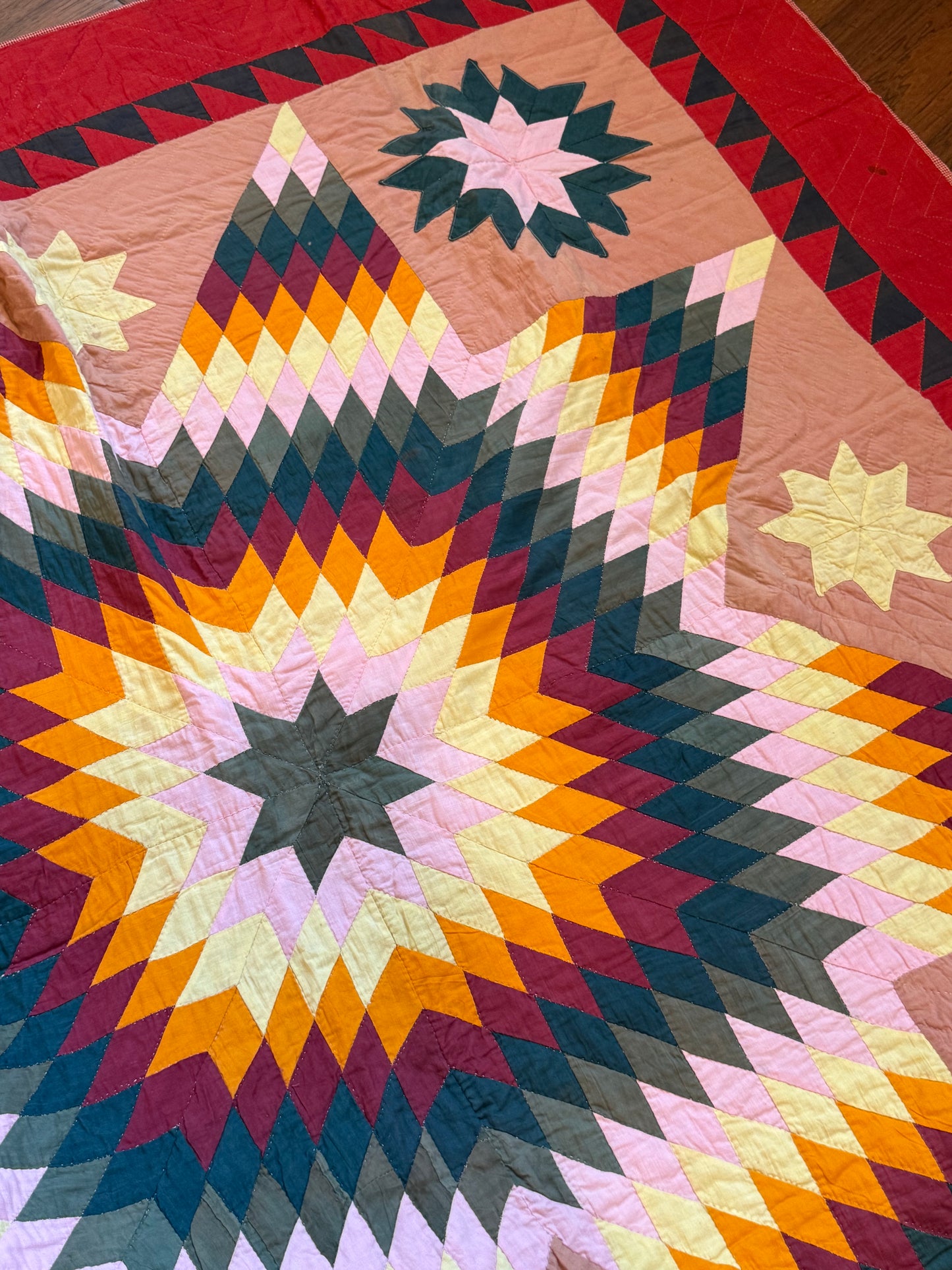 Blazing Star with Satellite Stars Quilt with a Sawtooth Border