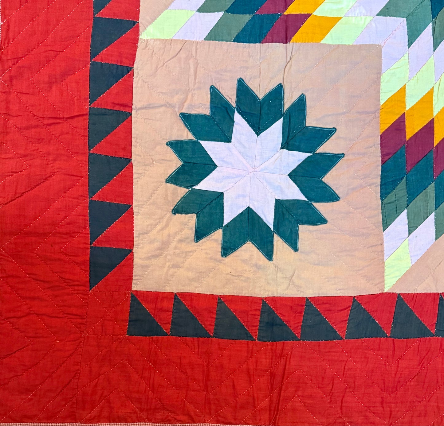 Blazing Star with Satellite Stars Quilt with a Sawtooth Border