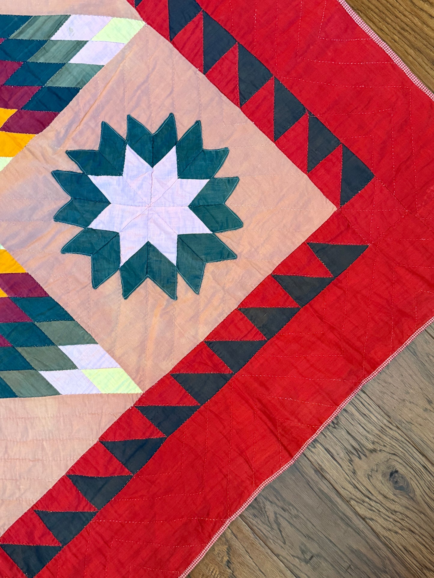 Blazing Star with Satellite Stars Quilt with a Sawtooth Border