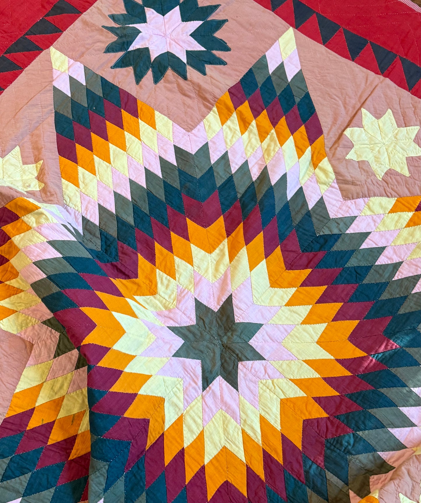 Blazing Star with Satellite Stars Quilt with a Sawtooth Border