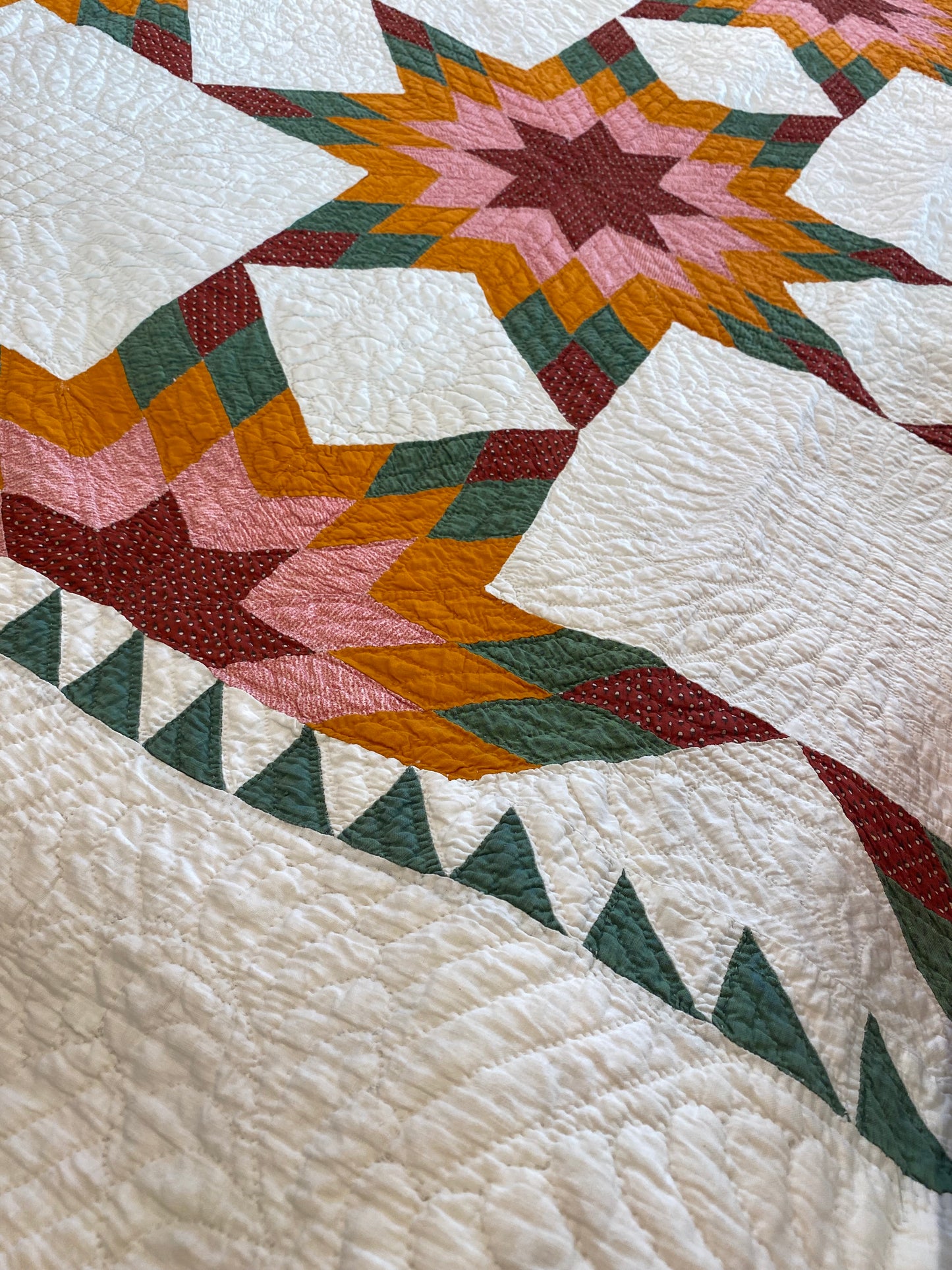 Touching 8 Point Stars Quilt with Sawtooth Border