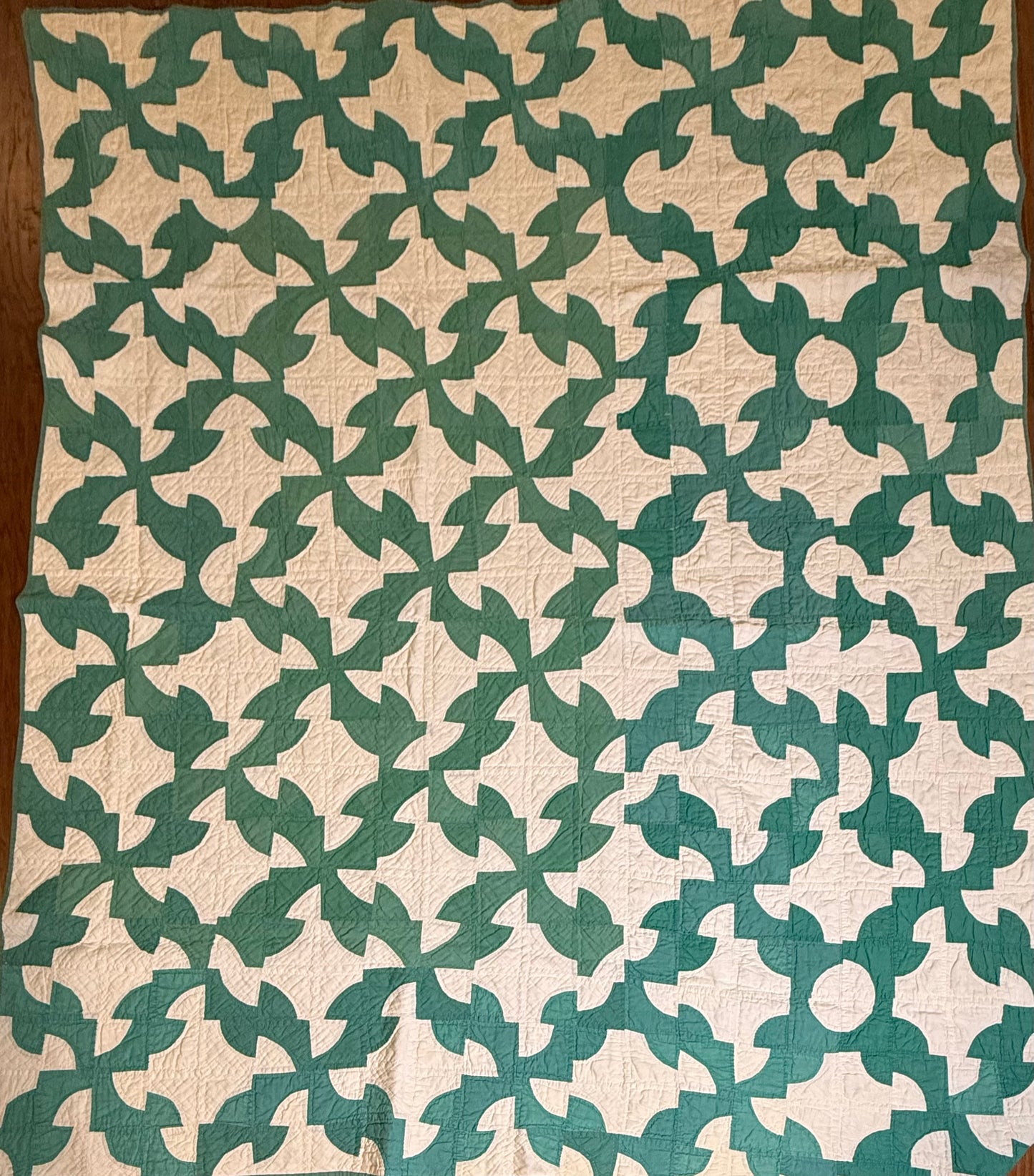 Green and White Drunkards Path Quilt