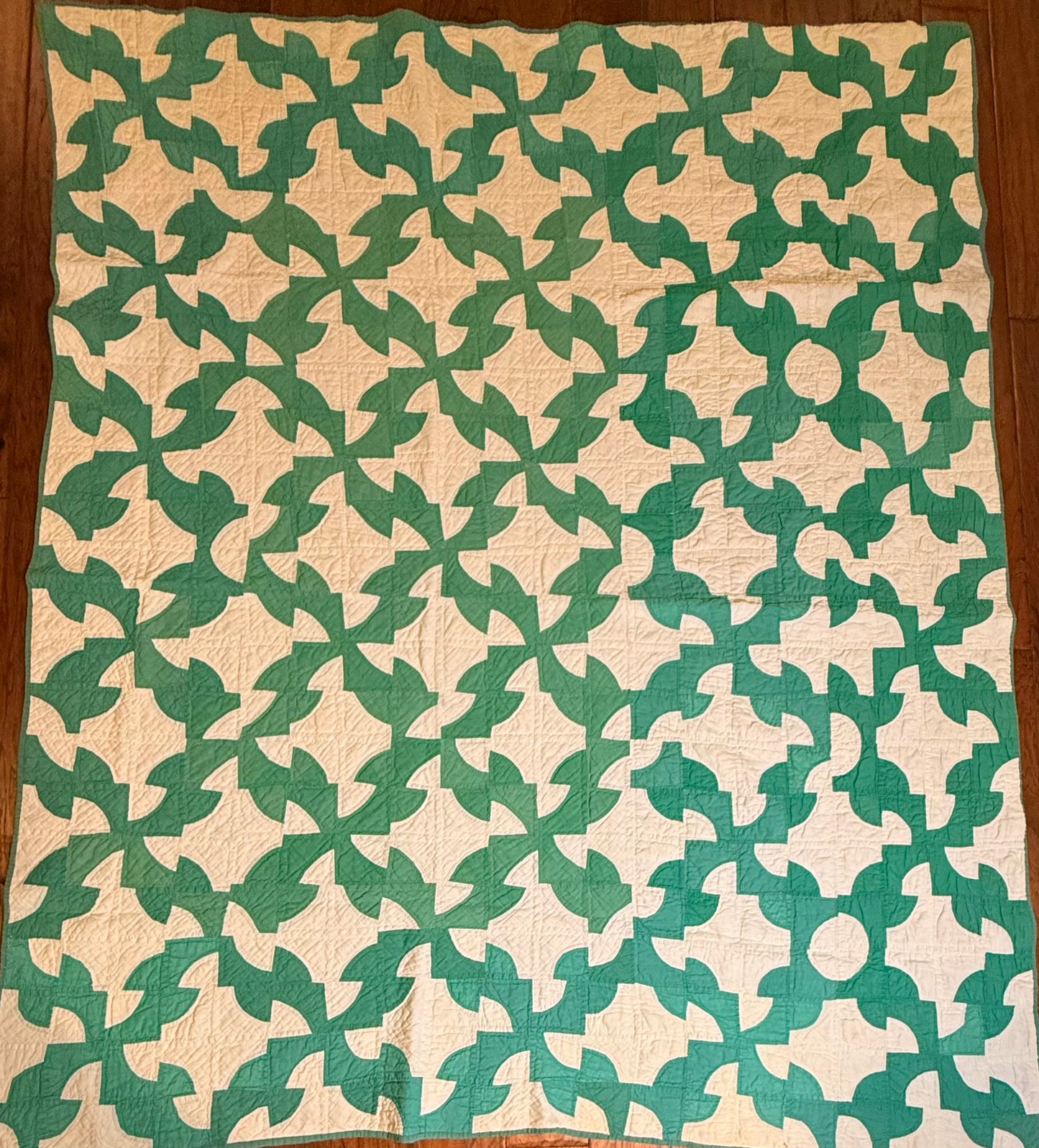 Green and White Drunkards Path Quilt