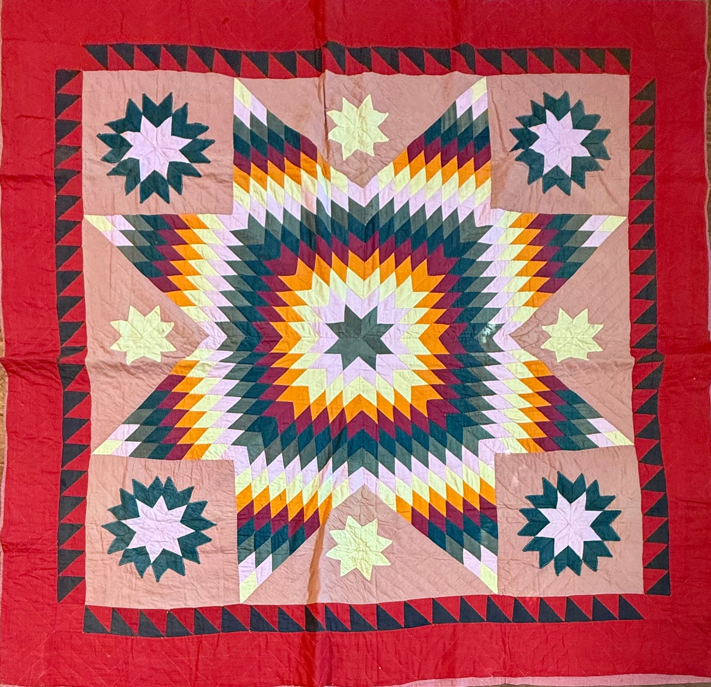 Blazing Star with Satellite Stars Quilt with a  Sawtooth Border