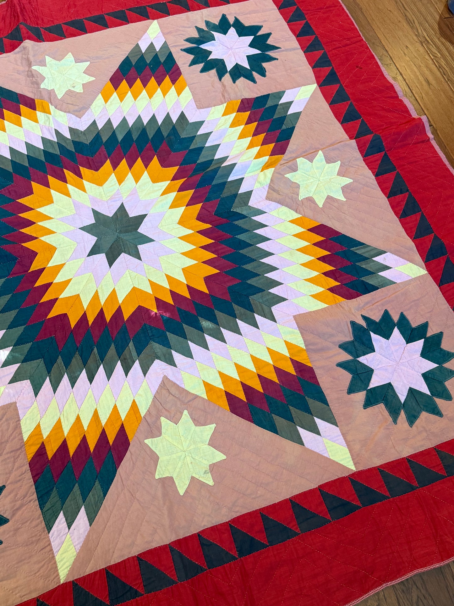 Blazing Star with Satellite Stars Quilt with a  Sawtooth Border
