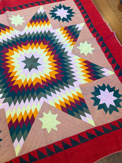 Blazing Star with Satellite Stars Quilt with a  Sawtooth Border