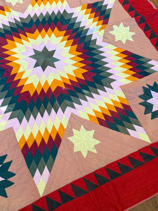 Blazing Star with Satellite Stars Quilt with a  Sawtooth Border