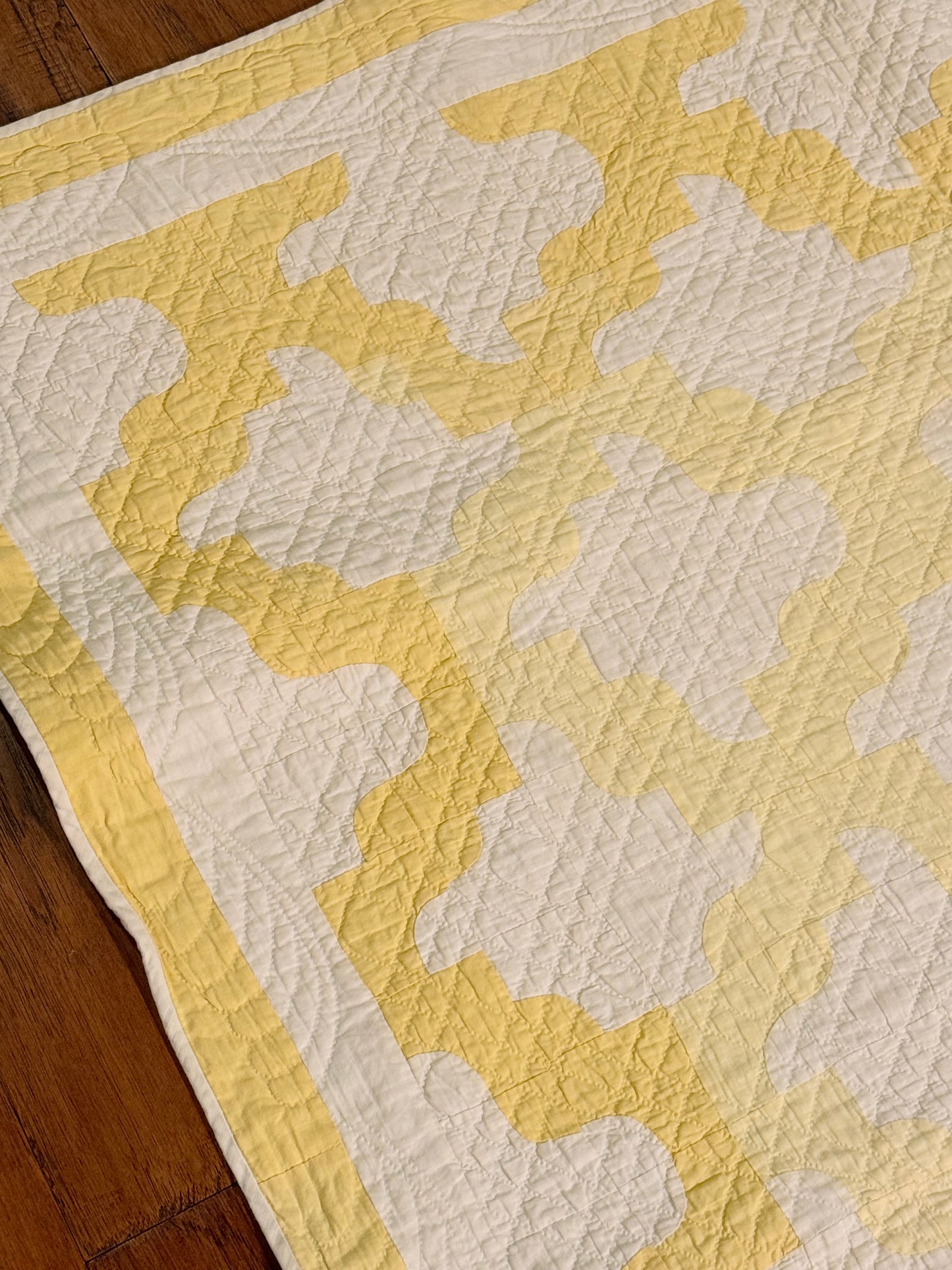 Yellow and White Drunkards Path Crib Quilti