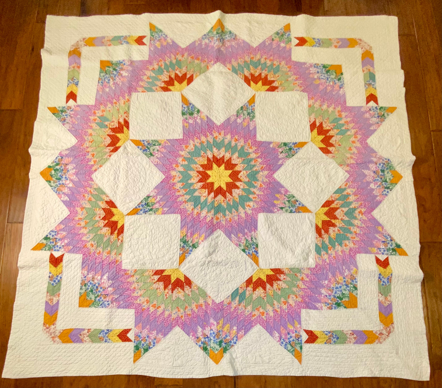 Unique Broken Star Quilt with Corner Framed Borders